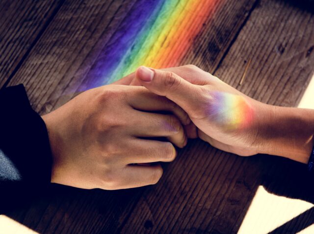 Hands Hold Together with Prism Lights